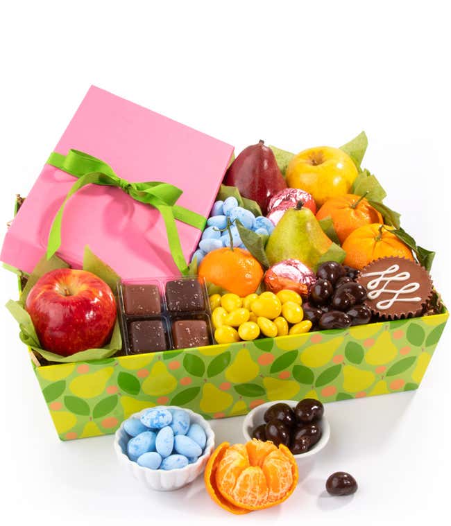 milk chocolate covered sandwich cookies, milk chocolate peanut butter cup, chocolate sea salt caramels, green and red D'Anjou pears, red apple, mandarins, chocolate cashews, lemon drops, and blue robin's eggs. 