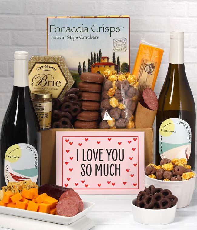A gift featuring Hill &amp; Harbor Pinot Noir, smoky sharp cheddar, Brie cheese spread, focaccia crisps, summer sausage, stone-ground mustard, chocolate-covered pretzels, chocolate-dipped cookies, caramel popcorn, and a romantic 'I Love You So Much' message.